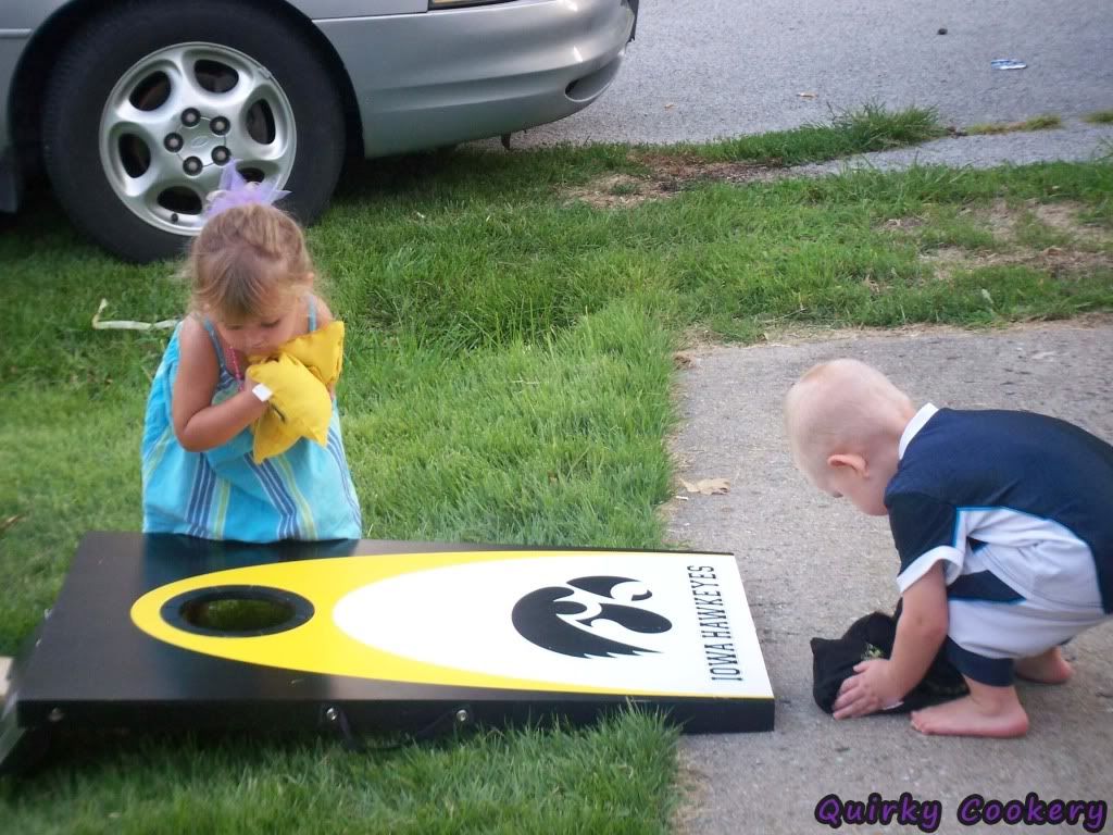Kids playing cornhole
