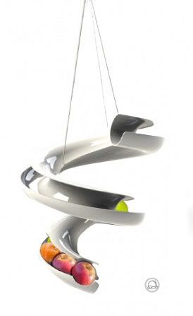 Stainless steel fruit slide where old fruit apples are at the front bottom and new is added to the top