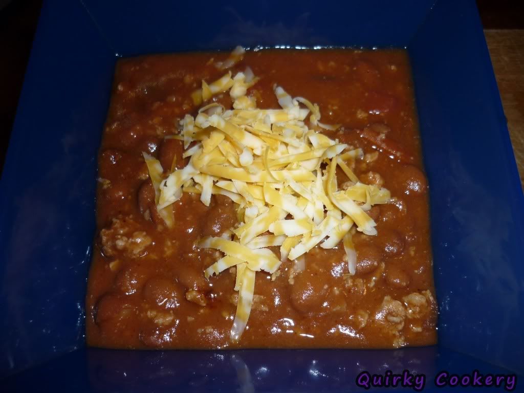 Chili with cheese for chili dogs at barbecue party