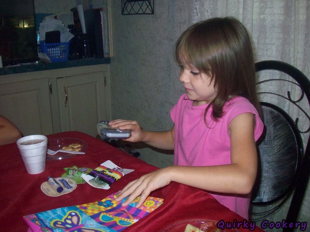 7 year old girl opening birthday presents