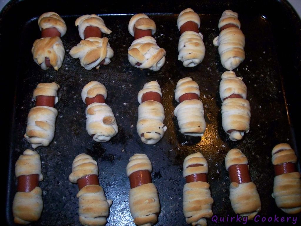 Mummies for Halloween - Refrigerated canned biscuits and hot dogs like pigs in blankets