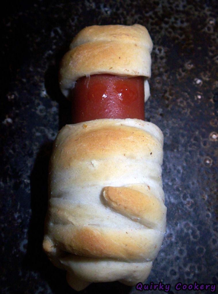 Halloween mummy with hot dog and biscuit wrapped around it