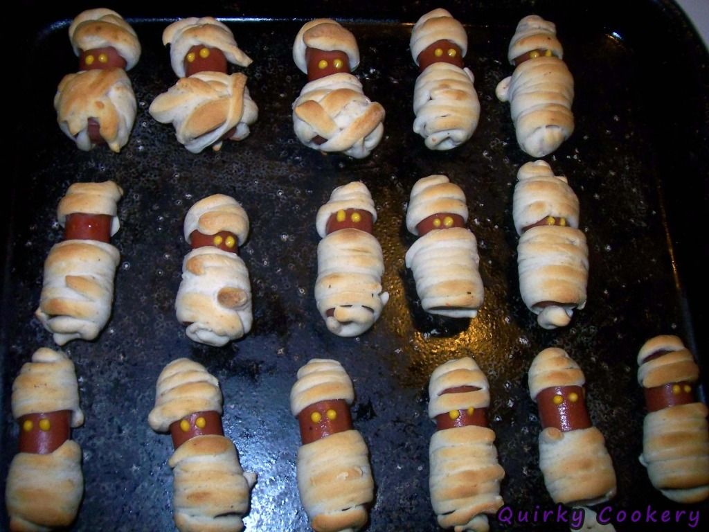 Halloween mummies made with hot dogs and biscuit dough