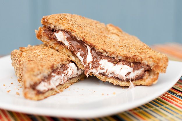 Smores french toast stuffed with nutella, marshmallow fluff and coated in graham crackers, backed