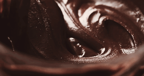Chocolate cake batter being swirled gif or brownies