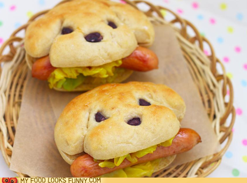 Bread shaped to look like dogs with hot dogs stuffed in each dog's mouth