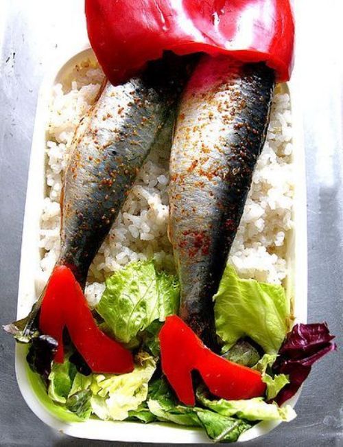 Bento box with whole fish legs, red pepper skirt, red pepper heel Dorothy ruby slippers, rice and salad