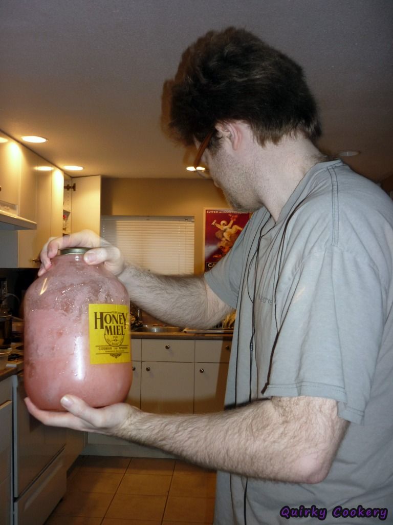 Using a Honey Miel Cossman and Whidden jar to shake koolaid pink lemonade in instead of a pitcher