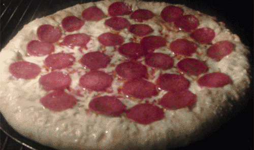 Pizza cooking gif - Pepperonis curling and cooking in a matter of seconds