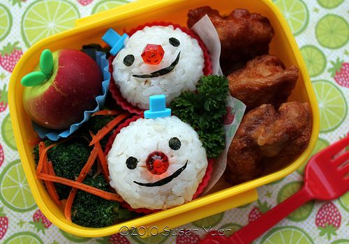 Onigiri rice balls in bento box for Christmas snowmen