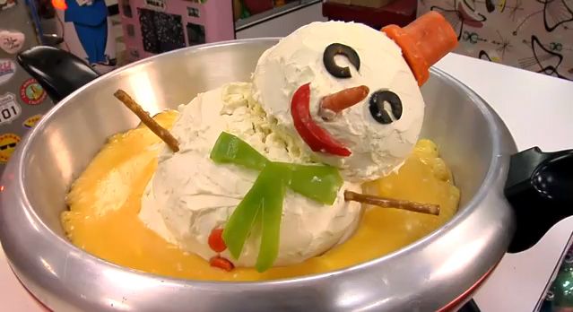 Snowman cheeseball that melts into fondue