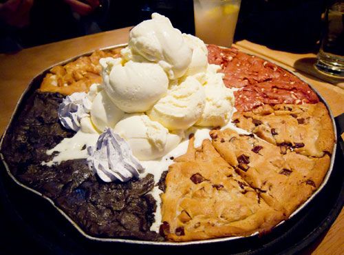 Cookie pie with chocolate chip cookies, oreo cookies, etc, plus ice cream on top