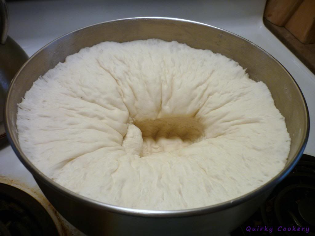 Punching down the homemade pizza dough for calzones