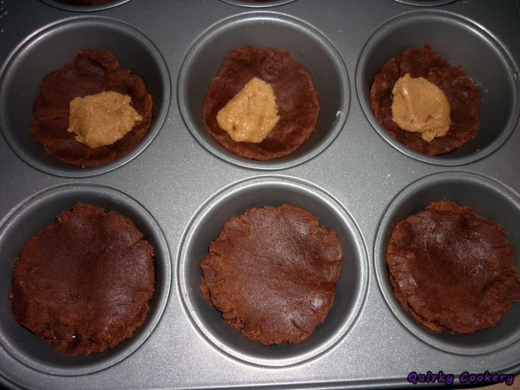 Cookies made in a muffin tin with peanut butter filling