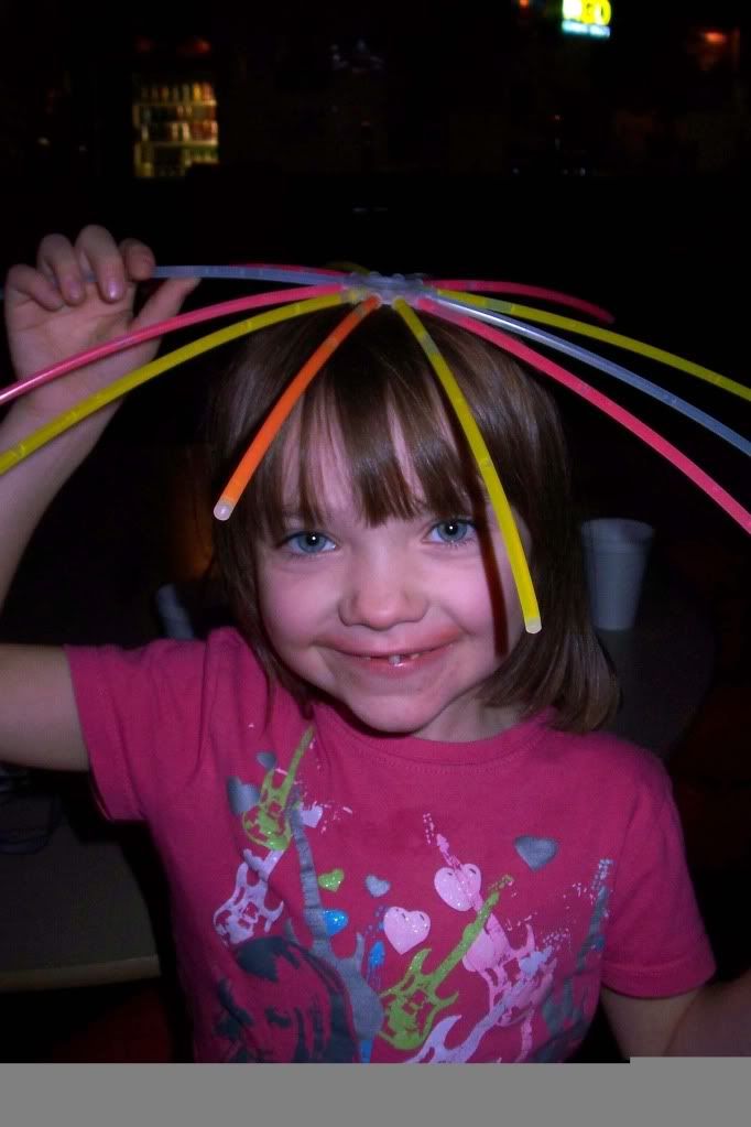 B with a glow stick ball on her head