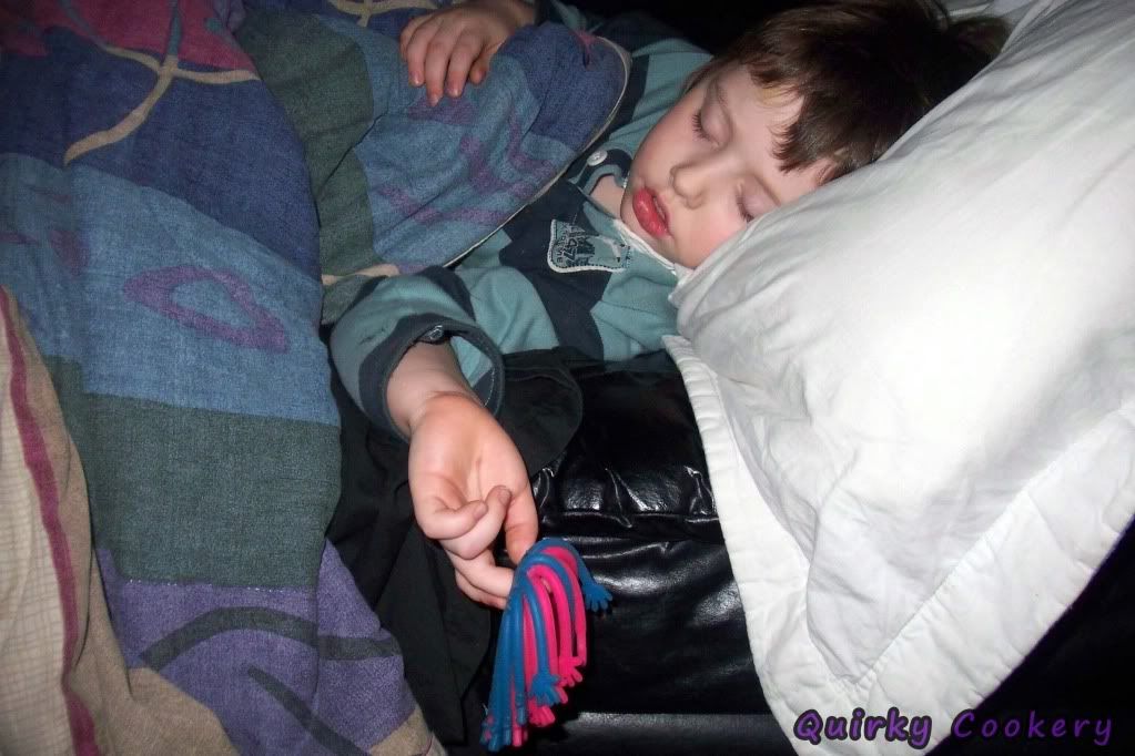 Kid man falling asleep with toy still