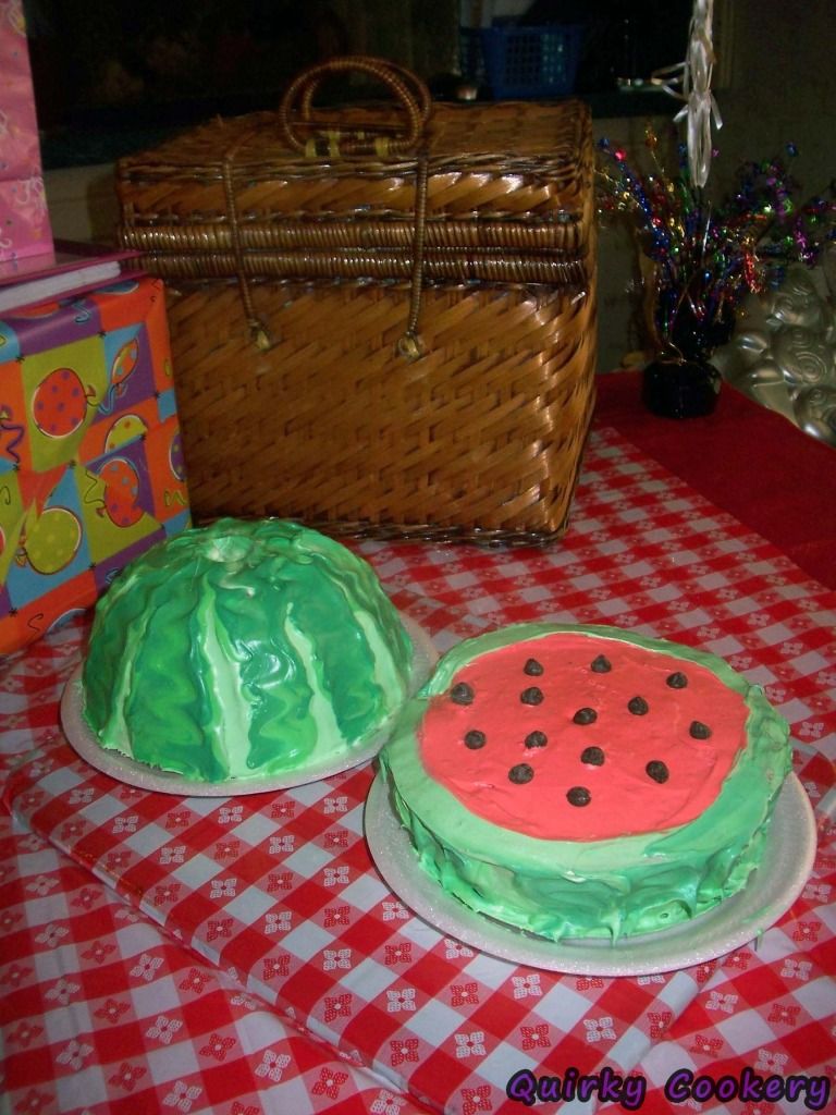 Watermelon birthday cake with chocolate chips, ants, and picnic basket
