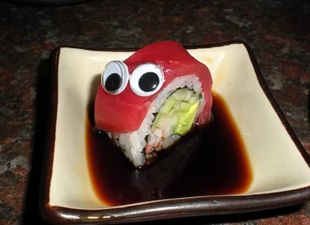 Googly eyes on a sushi roll to look like a snail or caterpillar