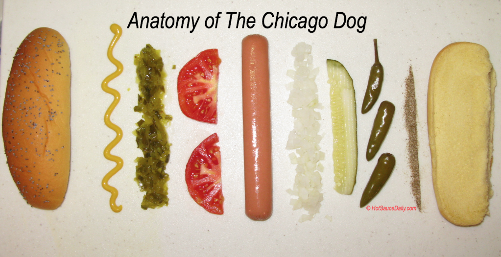 The best hot dogs - Picture shows the anatomy of the Chicago Dog including seasoned bun, yellow mustard, chopped sweet pickle relish, sliced fresh tomatoes, a basic hot dog, chopped onions, a dill pickle speer, two or three jalapeno peppers, ground black pepper, and the rest of the bun.  Put them on top to avoid them spilling out. 