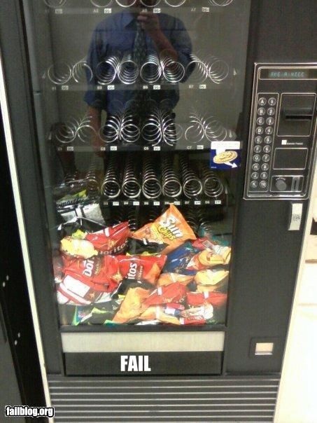 All the chips piled up in front of a broken vending machine fail. 