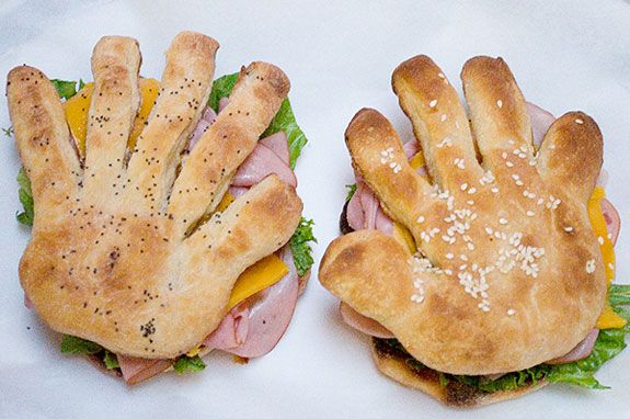 High five finger sandwiches where the bread dinner rolls are shaped into hands/fingers.
