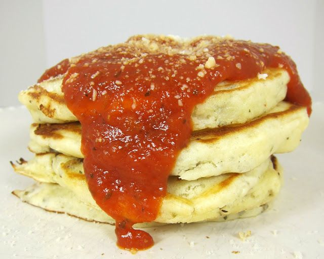 Pizza pancakes with suasage, pepperoni, and mushrooms in the batter without sugar along with pizza sauce and parmesan on top instead of syrup